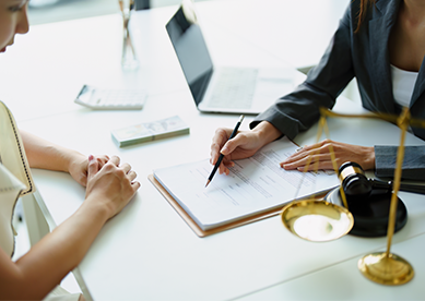 Person showing client information at a desk